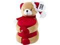 Soft toy animal holding a fleece blanket