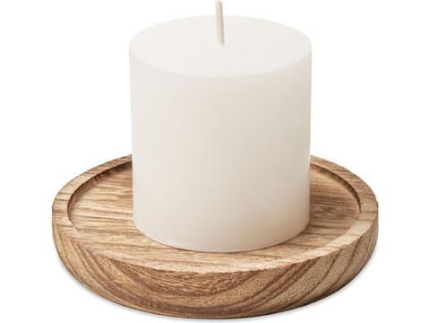 Candle on round wooden base