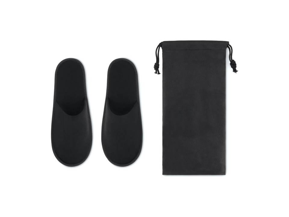 Chaussons d'hôtel dans une pochette